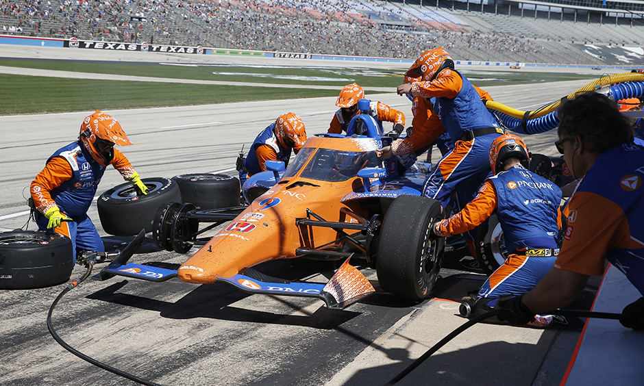 Race Driver Refuels During Pit Stop: Boosting Performance on the Track