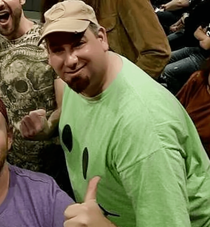 Whats the Deal with Green Shirt Guy WWE? (His Crazy Reactions Explained for You)