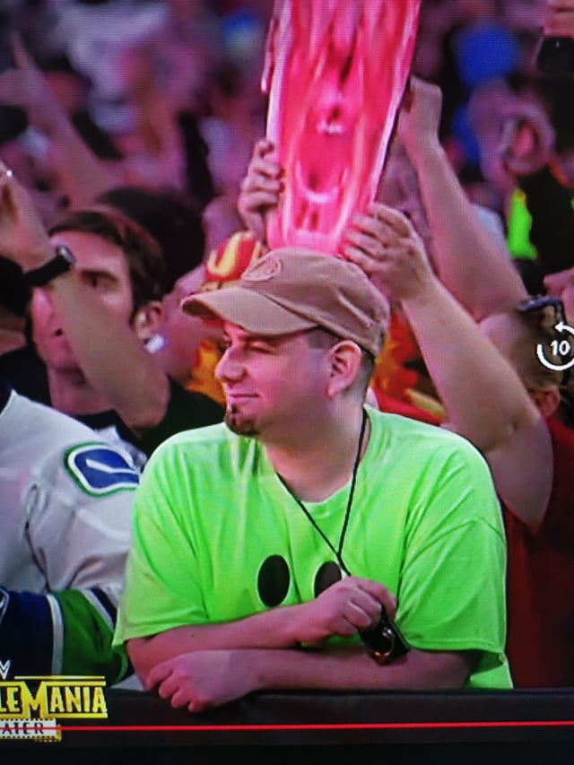 Whats the Deal with Green Shirt Guy WWE? (His Crazy Reactions Explained for You)
